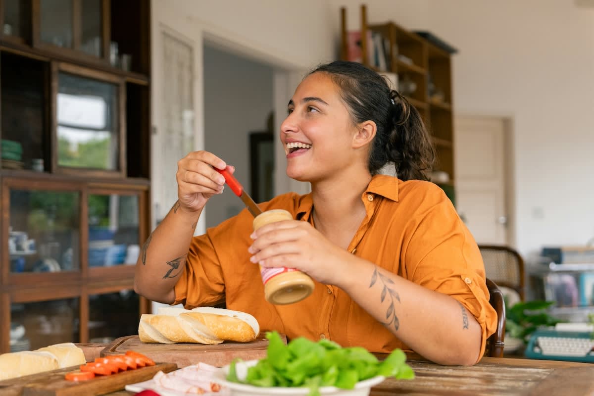 woman in orange eating healthy