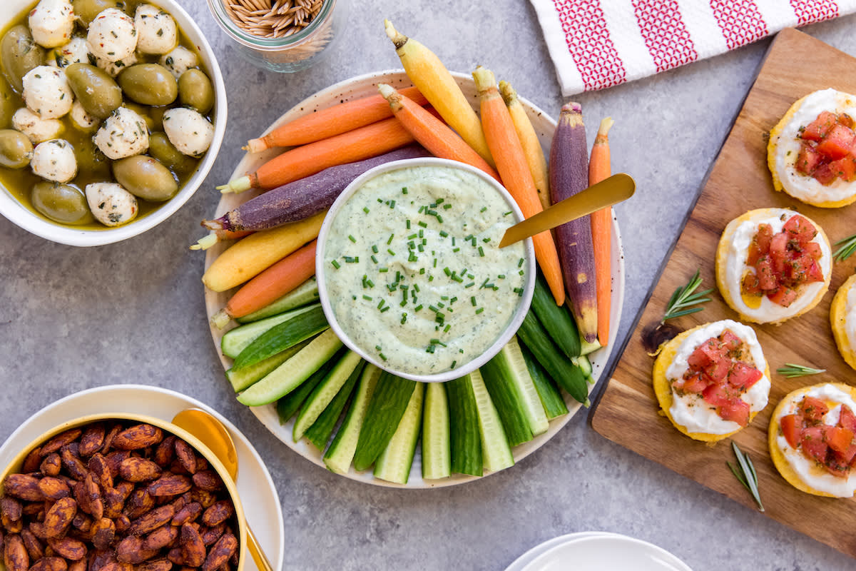 Healthy Snack Bites - Avocado Ranch Dip, Spiced Nuts, Marinated Olives and Mozzarella and Polenta Tomato Bites 